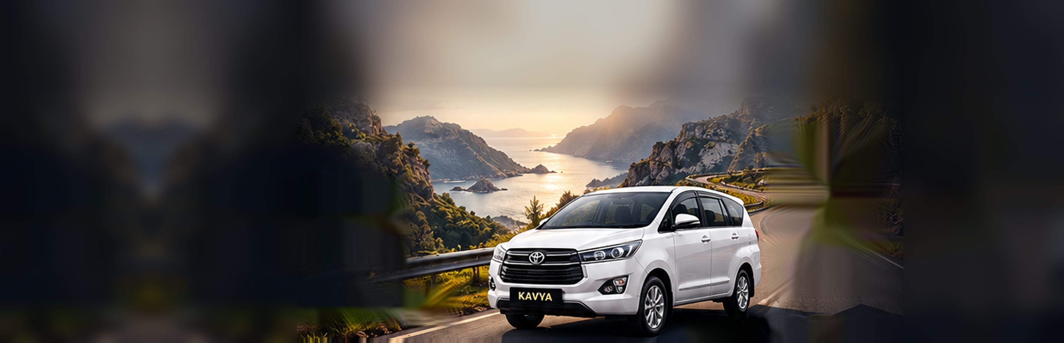 Kavya Tours & Travels Toyota Innova Crysta on a scenic coastal mountain road